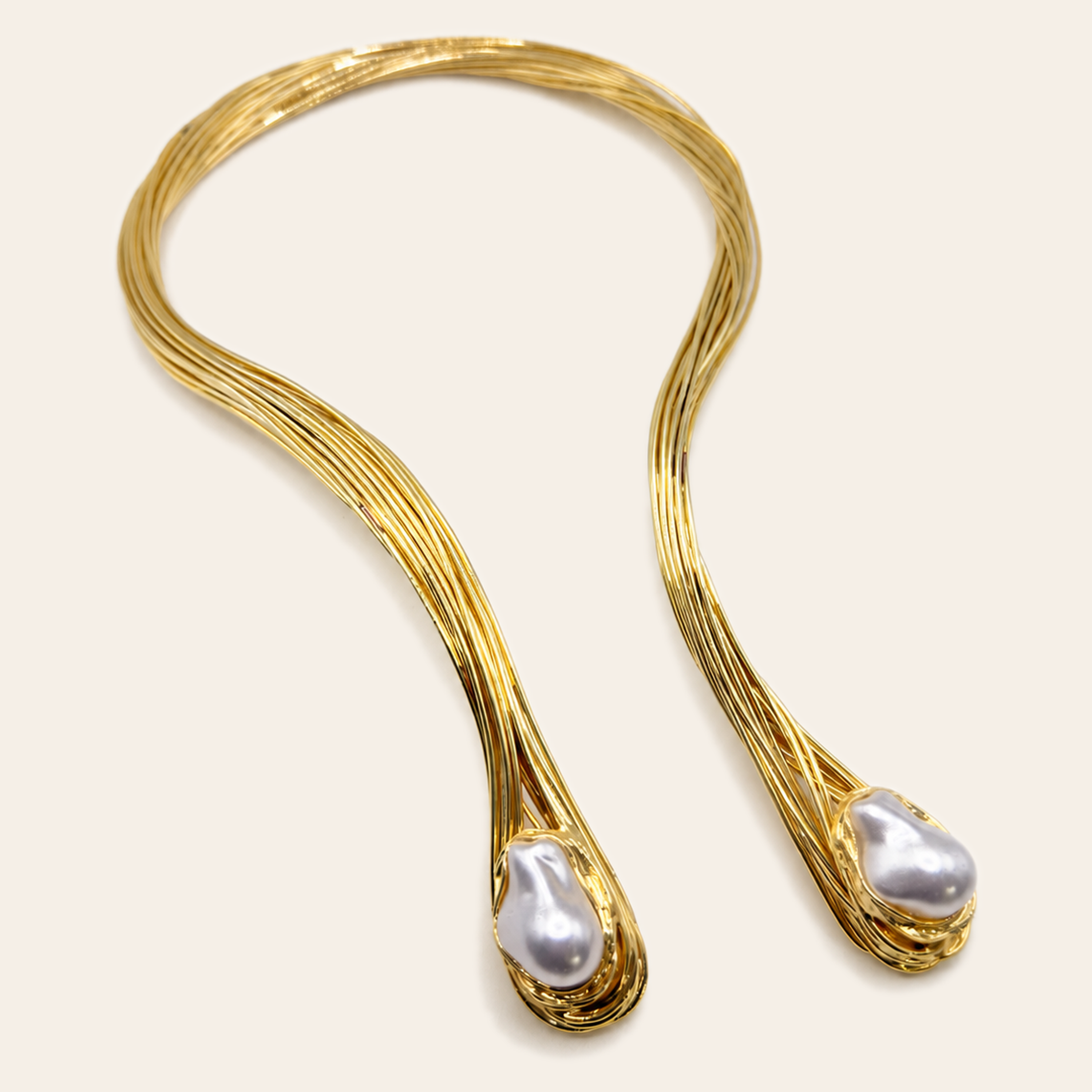 Gold wire necklace with white baroque pearl drops